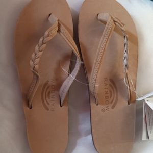 Rainbow flip flops/ bridge, brand new never worn. Cost 70 bucks size 9